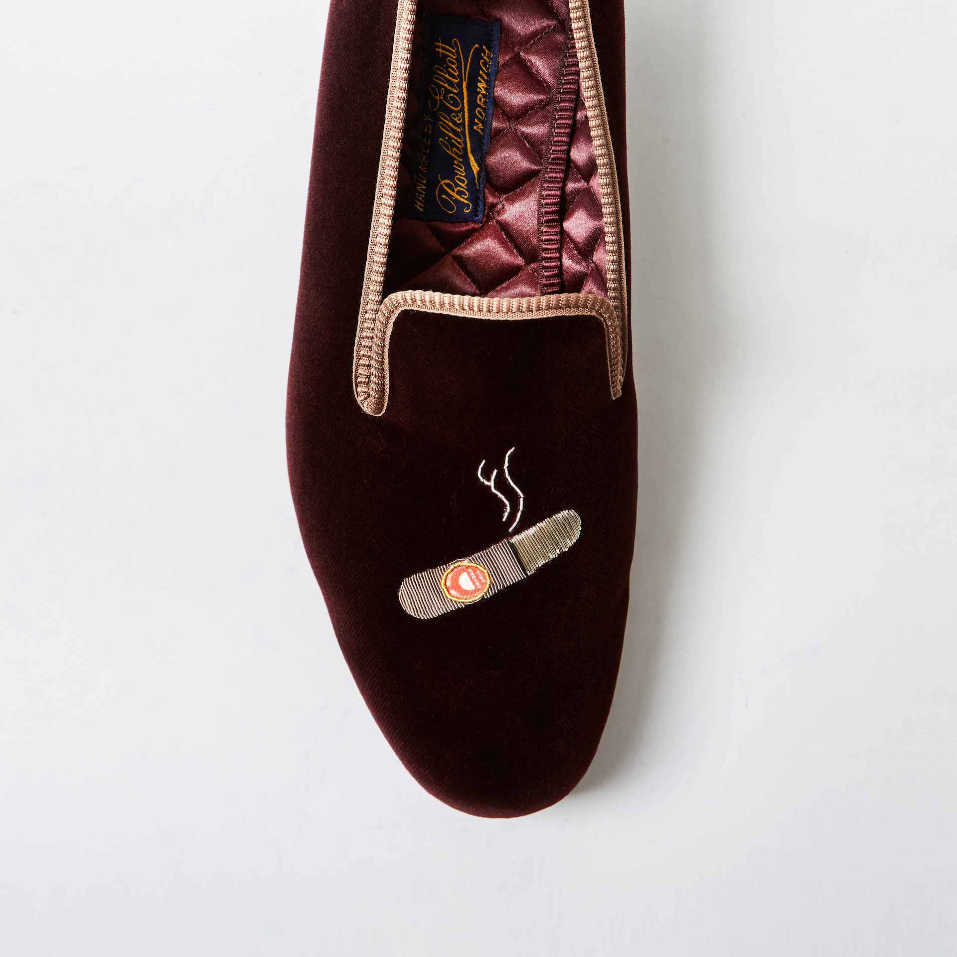 Brown Bowhill and Elliott velvet Albert Slippers embroidered with cigars at Waring Tuxedos in Fort Worth.