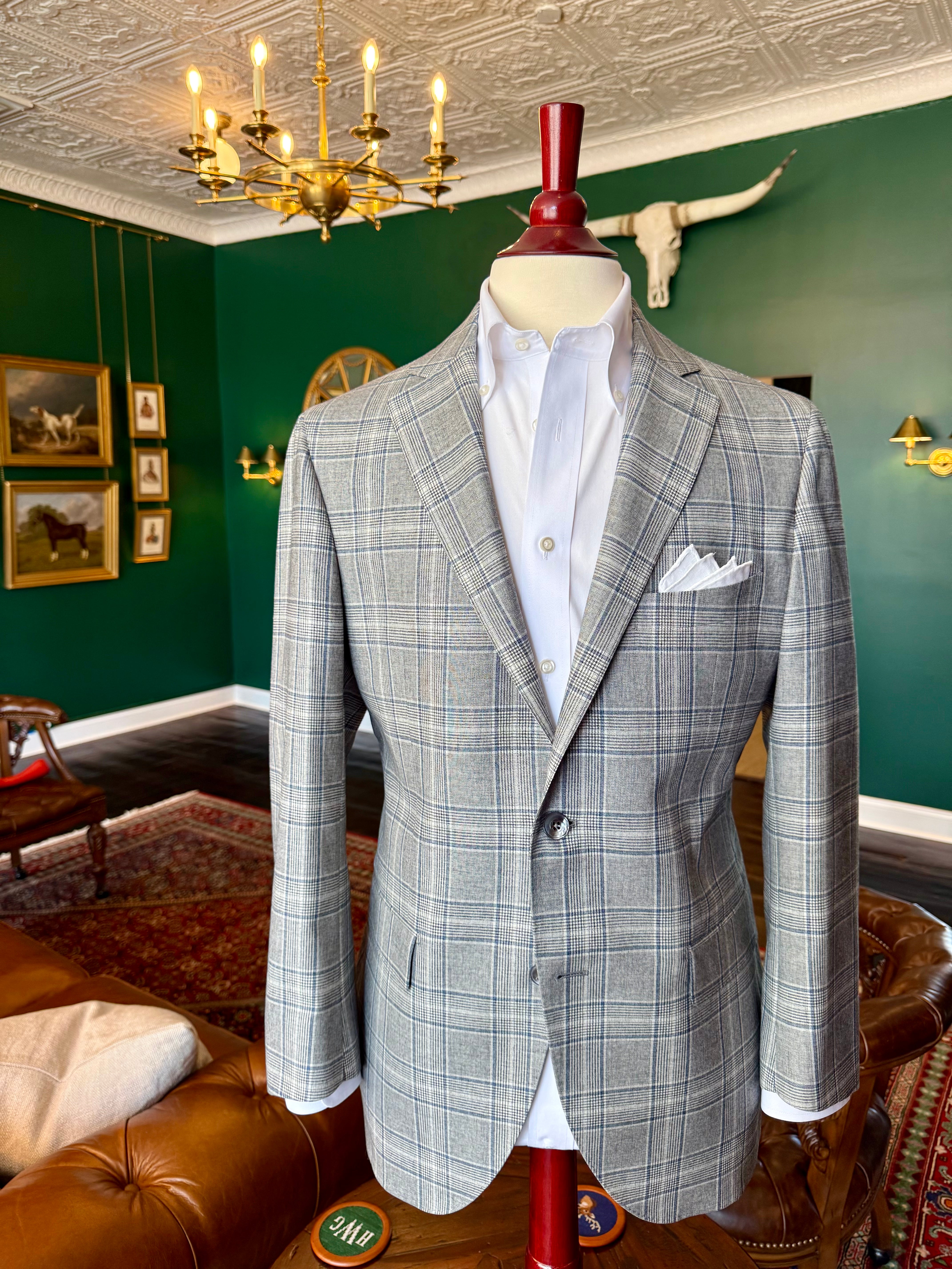 Gray plaid sport coat displayed on a mahogany mannequin at Waring Tuxedos in Fort Worth