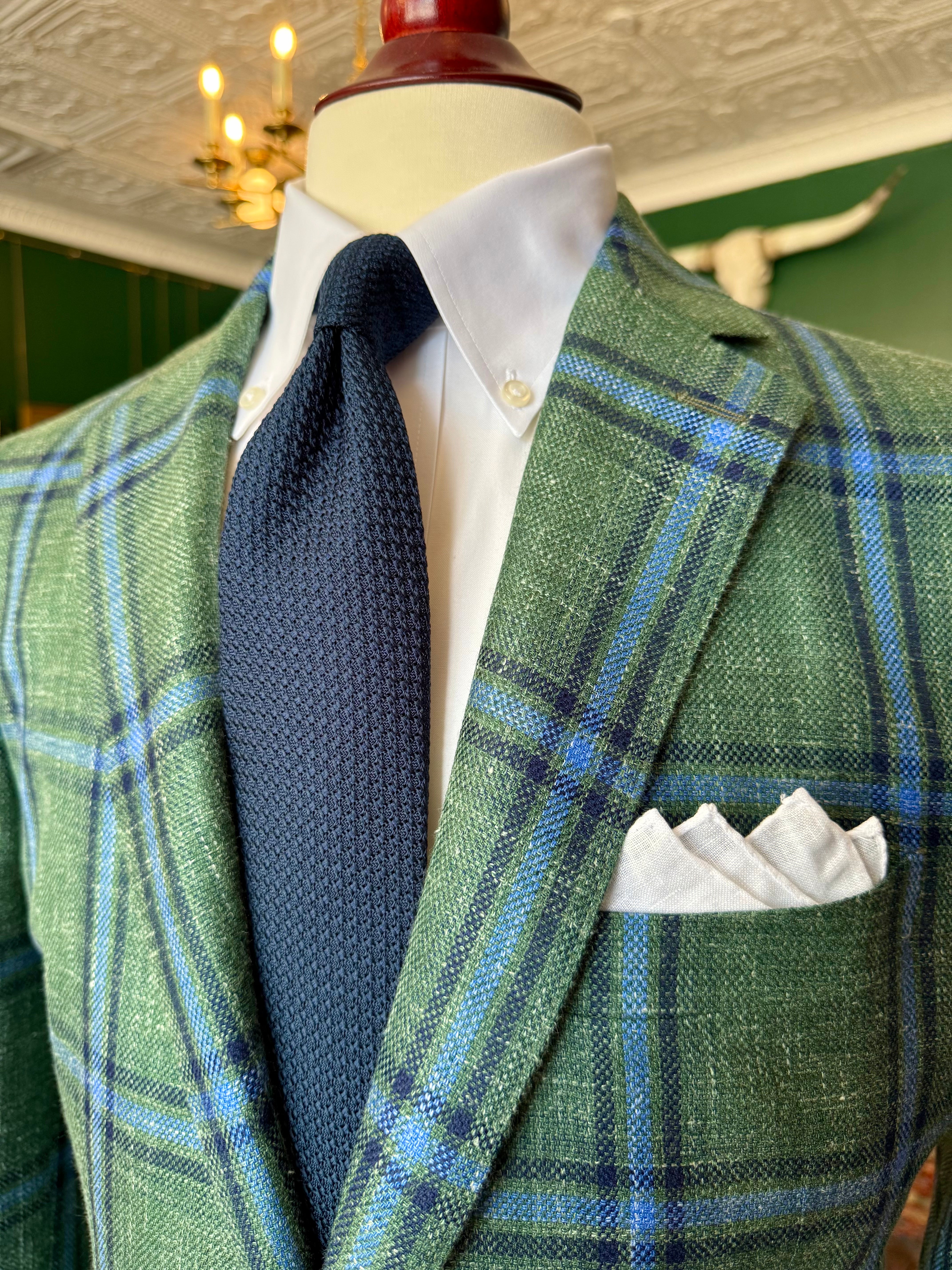 Green and blue windowpane sport coat at Waring Tuxedos, displayed on a mahogany mannequin in our Fort Worth showroom
