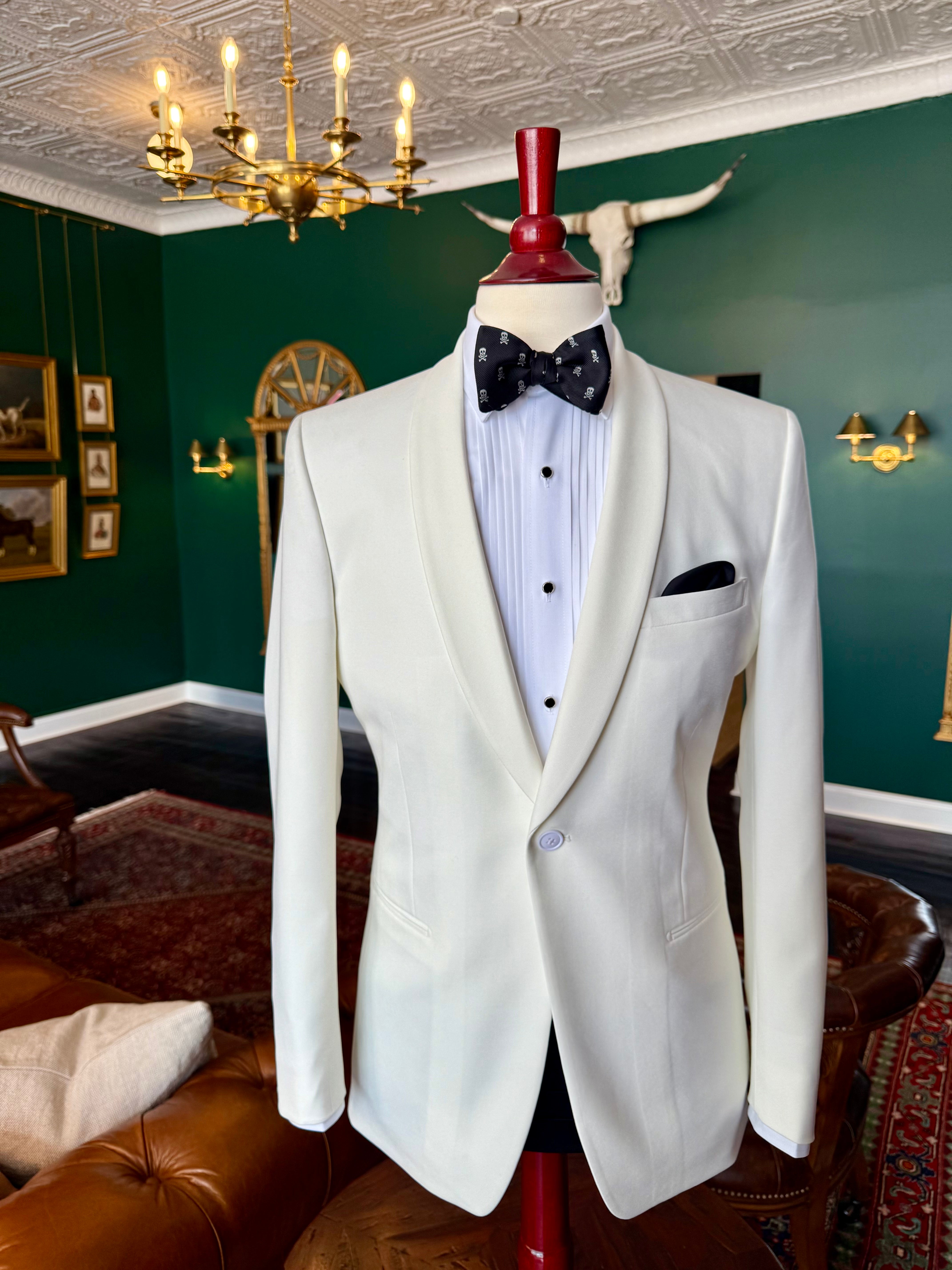 Classic ivory dinner jacket on mahogany mannequin, available for rent at Waring Tuxedos in Fort Worth.
