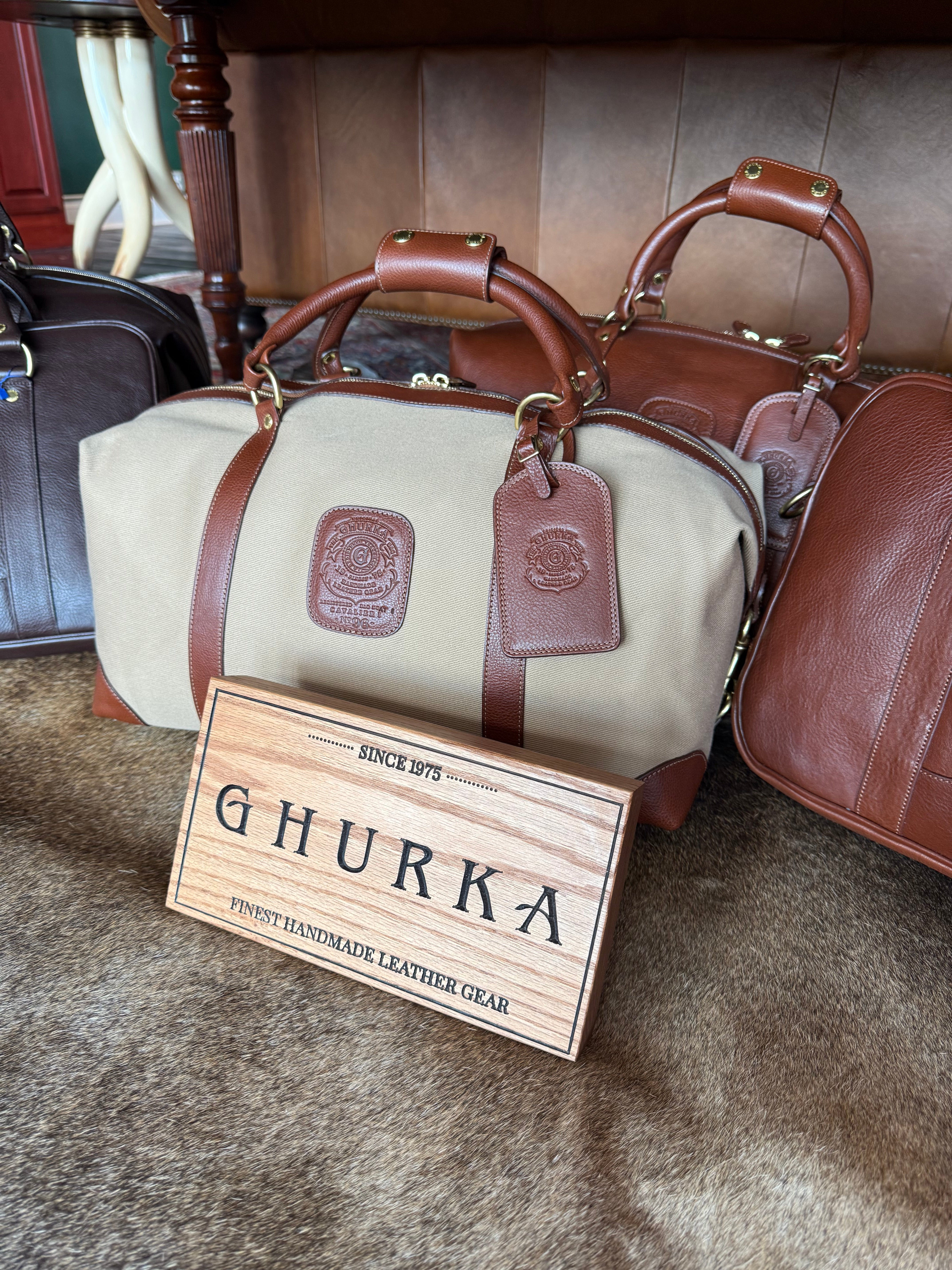 Ghurka luggage on display in Waring Tuxedos in Fort Worth