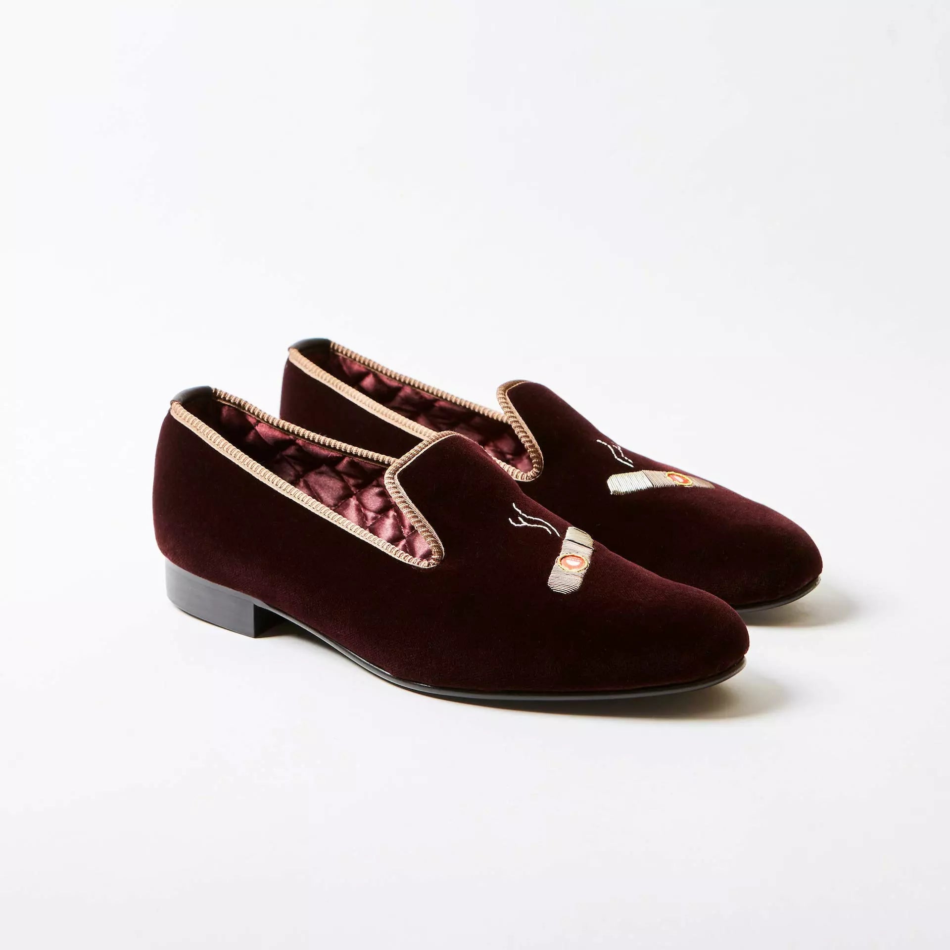 Brown Bowhill and Elliott velvet Albert Slippers embroidered with cigars at Waring Tuxedos in Fort Worth.