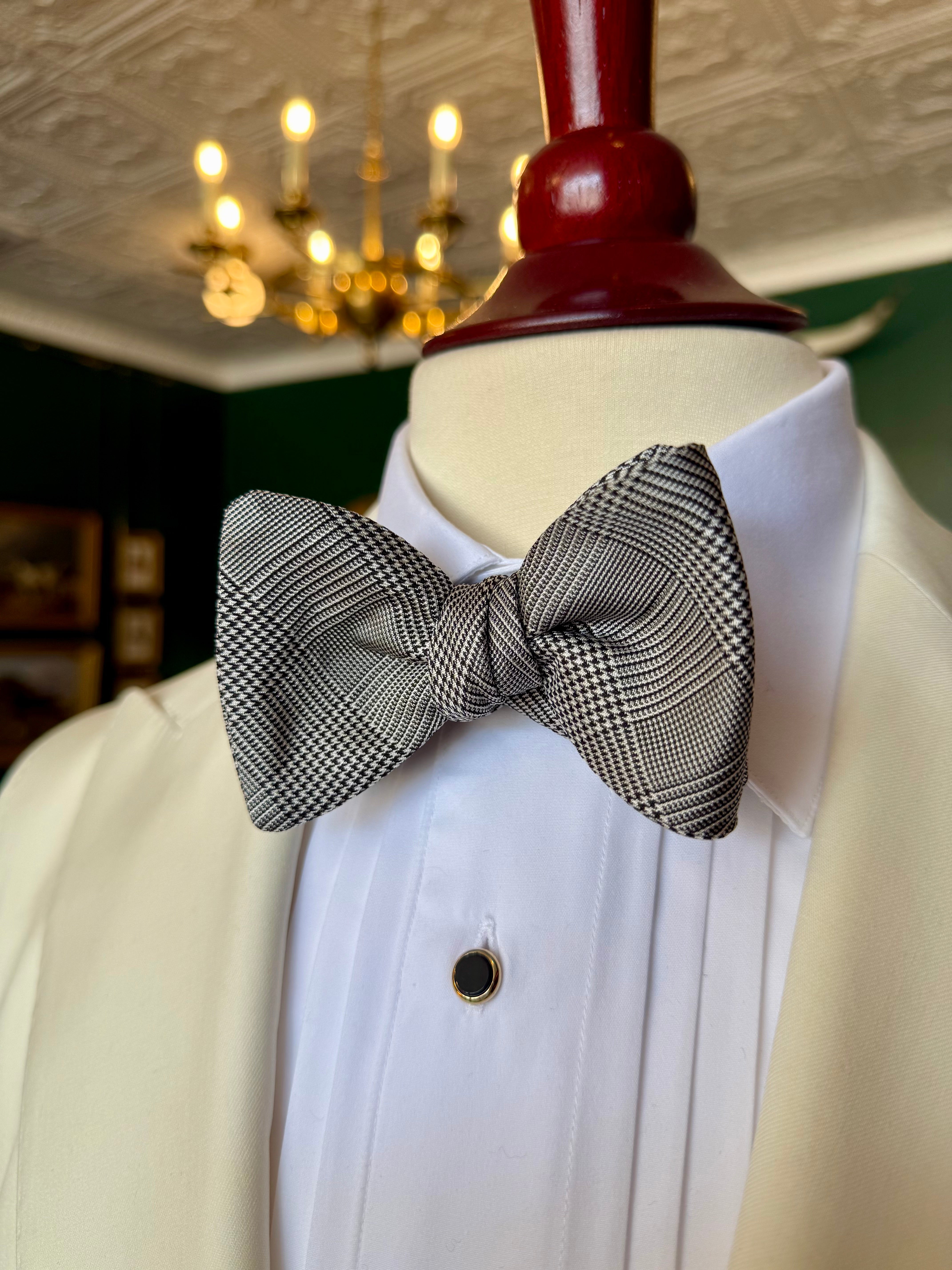 Prince of Wales Bow Tie from Waring Collection at Waring Tuxedos in Fort Worth, displayed on mahogany mannequin.