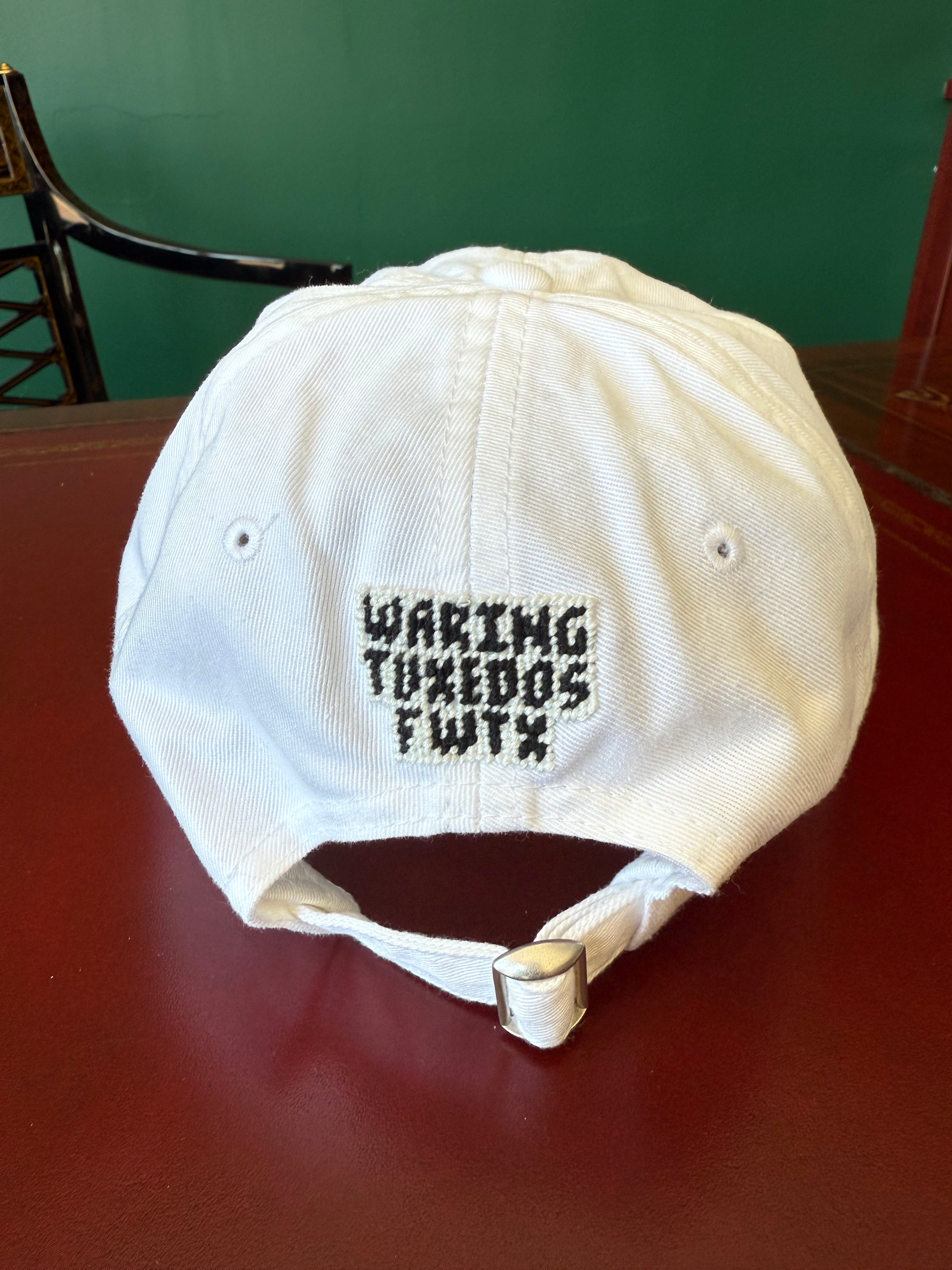 White cotton twill baseball cap with needlepoint Waring Tuxedos Fort Worth logo by Smathers & Branson